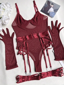 Detail of burgundy mesh bodysuit lingerie set with matching gloves and garter straps