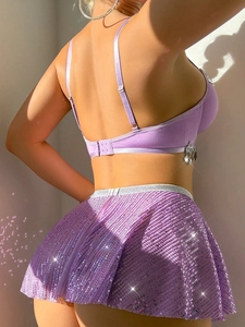 Detail of purple sequin lingerie set featuring silver charm and back buckle bra