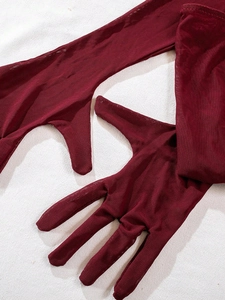 Detail of dark red sheer mesh gloves with fine net texture for lingerie set styling