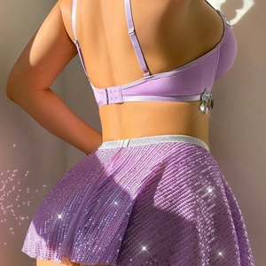 Sexy purple sequin outfit for women featuring sparkling crop top and mini skirt