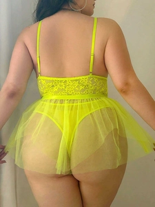 Back view of plus size fluorescent green lace and mesh lingerie with open back design