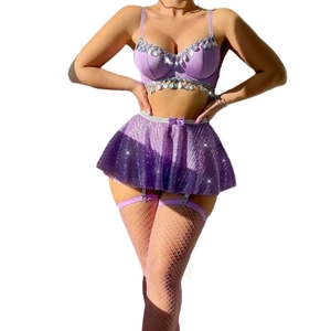 Three-piece purple sequined lingerie set with bra top, mini skirt and fishnet stockings