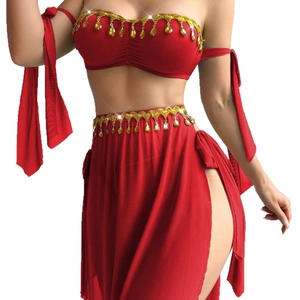 Red belly dance outfit featuring sequined crop top and high slit skirt with amber charms