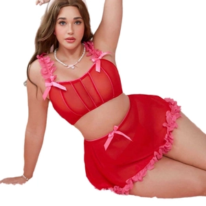 Two-piece red mesh lingerie set with pink bows and ruffle trim for a sweet sexy look