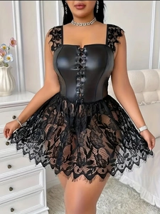 Close-up of black faux leather corset dress with floral eyelash lace and ribbon detail