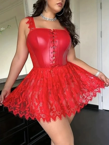 Detail of red plus size faux leather dress with lace trim and lace-up corset front