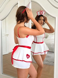 Mirror view showing front and back details of white nurse cosplay outfit with red trim