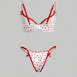 White satin heart print bikini lingerie set with red lace trim and bow details