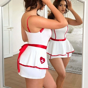 Sexy white nurse cosplay costume set with red trim and cross detail seen in mirror
