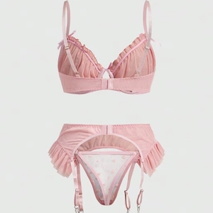Pink three-piece mesh bra set with heart ruffles, garter belt and polka dot lace panties