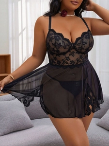 Close-up of black floral lace and sheer mesh nightgown set with deep V-neckline