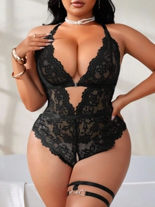 Detailed close-up of floral lace lingerie with deep V-neck and cut-out waist design