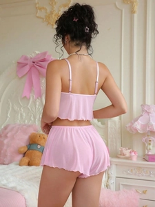 Rear view of pink mesh loungewear set featuring ruffle trim and thin spaghetti straps