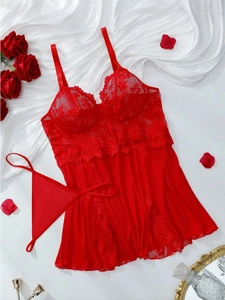 Detailed view of red lace lingerie set with sheer mesh babydoll and matching G-string