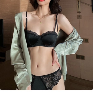 Elegant black lace and satin lingerie set styled with a silky sage green shirt for women