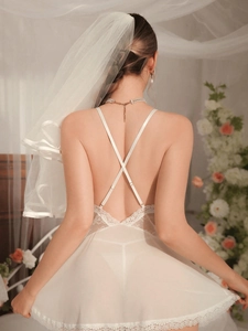 Detailed back view of a lace bridal nightdress with cross straps and sheer mesh veil
