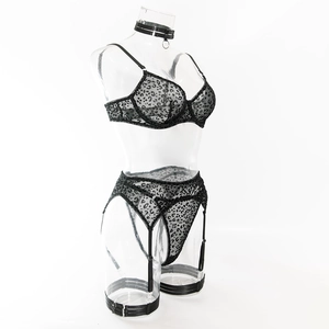 Detail of 5-piece black leopard print sexy lingerie set with mesh fabric on model