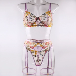Detail showing sheer purple mesh with floral embroidery on underwire bra and garter
