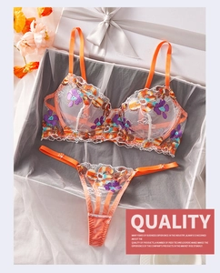 Lace mesh lingerie set with colorful floral embroidery displayed in a premium gift box