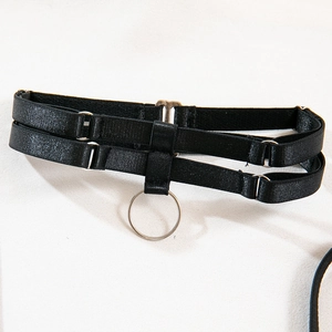 Macro view of adjustable black choker with silver O-ring hardware and elastic strap