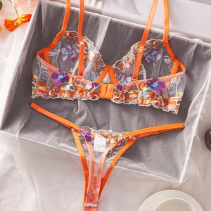 Lace lingerie set with colorful floral embroidery and vibrant orange mesh trim