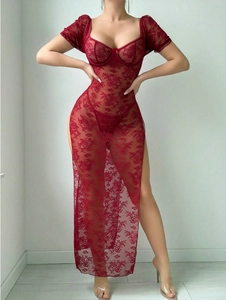 Detailed close-up of red floral lace bodycon dress with sheer mesh and high side slit