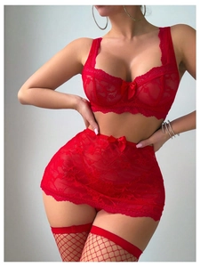 Close-up of red floral lace lingerie set featuring bow details and mesh stockings