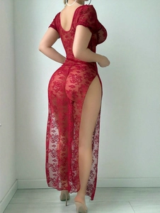 Detail of red floral lace bodycon dress showing sheer crochet fabric and slim fit