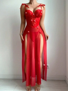 Detail of red sheer evening gown with floral lace embroidery and high slit mesh skirt