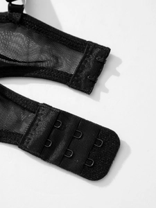Detail of black mesh bodysuit featuring high-density stitching and 3x2 hook and eye closure