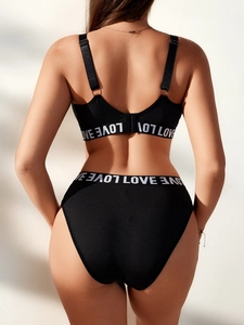 Detail of sexy black bra set with LOVE letter elastic bands and adjustable straps