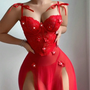Red sheer evening gown with floral lace, pearl accents, and high-slit mesh skirt