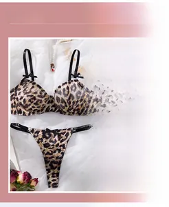 Macro detail of sexy leopard print lace lingerie set with fine mesh texture and bow