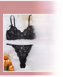 Detailed close-up of sunflower embroidery on black lace sexy lingerie set with fine stitching