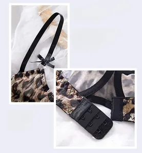 Detailed view of leopard print lace bra set with mesh fabric and black bow accents