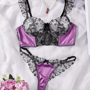 Detail of purple satin and black floral lace embroidery on this sexy lingerie set