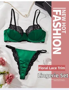 Sexy dark green lingerie set with floral lace patchwork and satin detail on white silk
