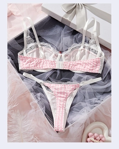 Flat lay of pink plaid lace lingerie set with bra and thong in a romantic gift box