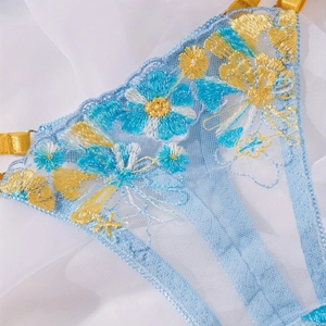 Lace lingerie set with blue mesh and yellow daisy floral embroidery for a fresh style