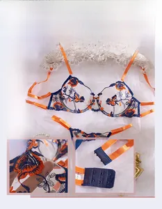 Detail of floral embroidery on mesh lingerie set with back hook-and-eye closure