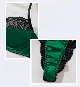 Macro shot of dark green satin bra set with intricate black floral lace trim detailing