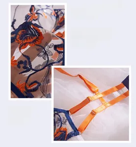 Detail of blue embroidery lace lingerie with orange flower patterns and adjustable straps