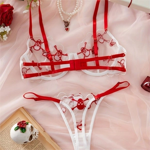 White lace lingerie set with red skeleton embroidery and scalloped wave edges