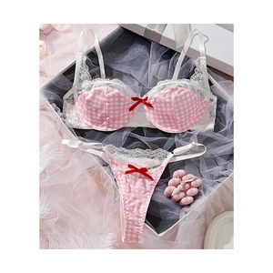 Pink and white checkered lingerie set with lace trim and red bows in a luxury gift box