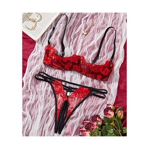 Lace lingerie set featuring red rose embroidery and open cup design with thong
