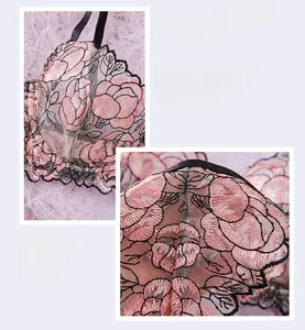 Detailed embroidery of pink roses with black outlines on sheer lace lingerie bra