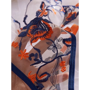 Sexy blue mesh lingerie set with intricate orange floral embroidery and adjustable straps