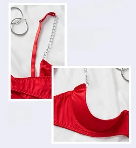 Detail of red satin lingerie set with silver metal shoulder chains and U-cut cups