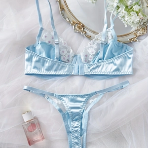 Elegant light blue lingerie set with white lace floral embroidery and satin finish