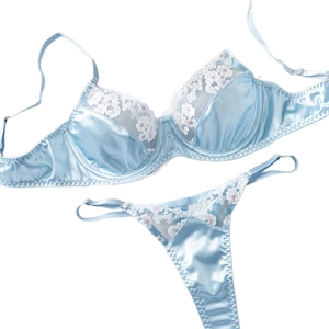 Light blue satin lingerie set with white floral embroidery and underwire lace bra